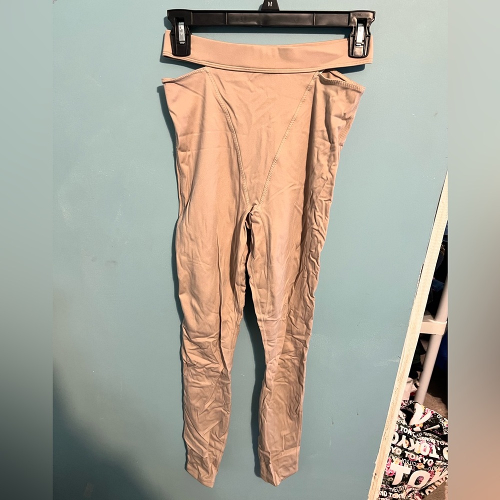 Madeline Petsch Fabletics leggings with top cutouts